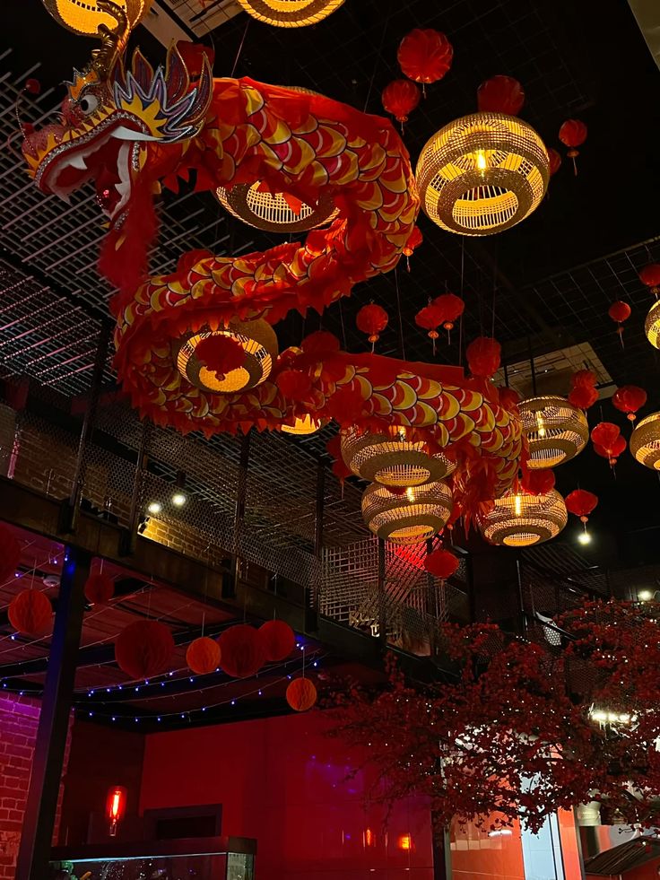 Golden dragon and hanging lanterns above the dining room at Lantern