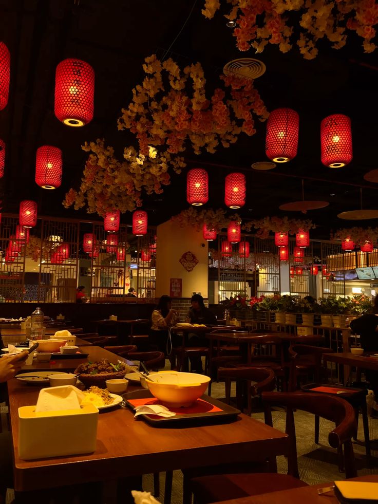 Dining room glowing with red lanterns at Lantern