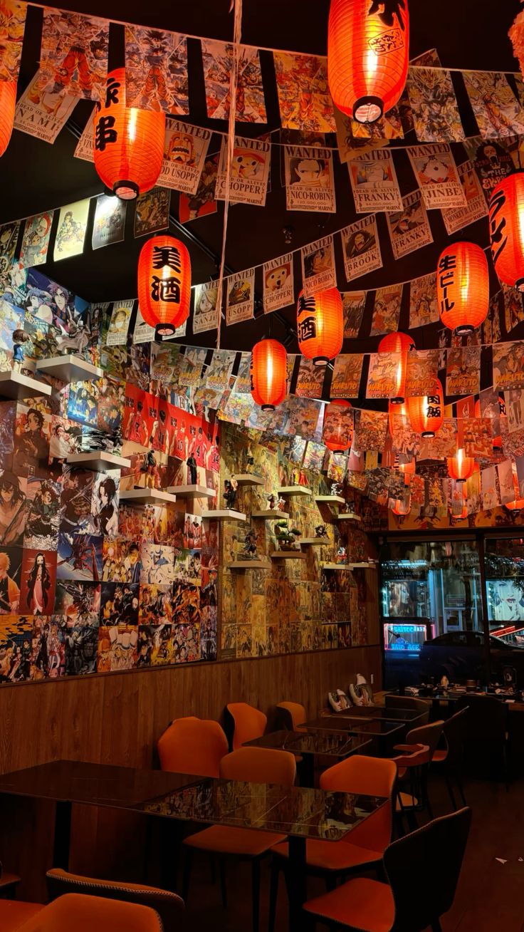 Red paper lanterns and art-covered walls inside Lantern